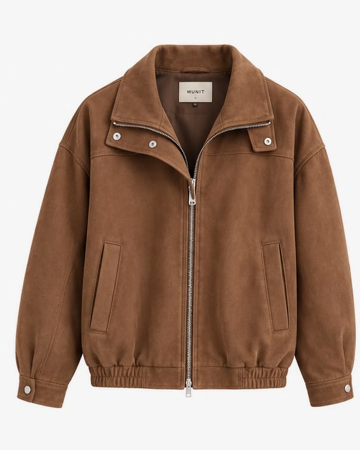 The jacket photographed flat from the front: point collar, open two-way zip, snapped storm flap, two welt pockets.